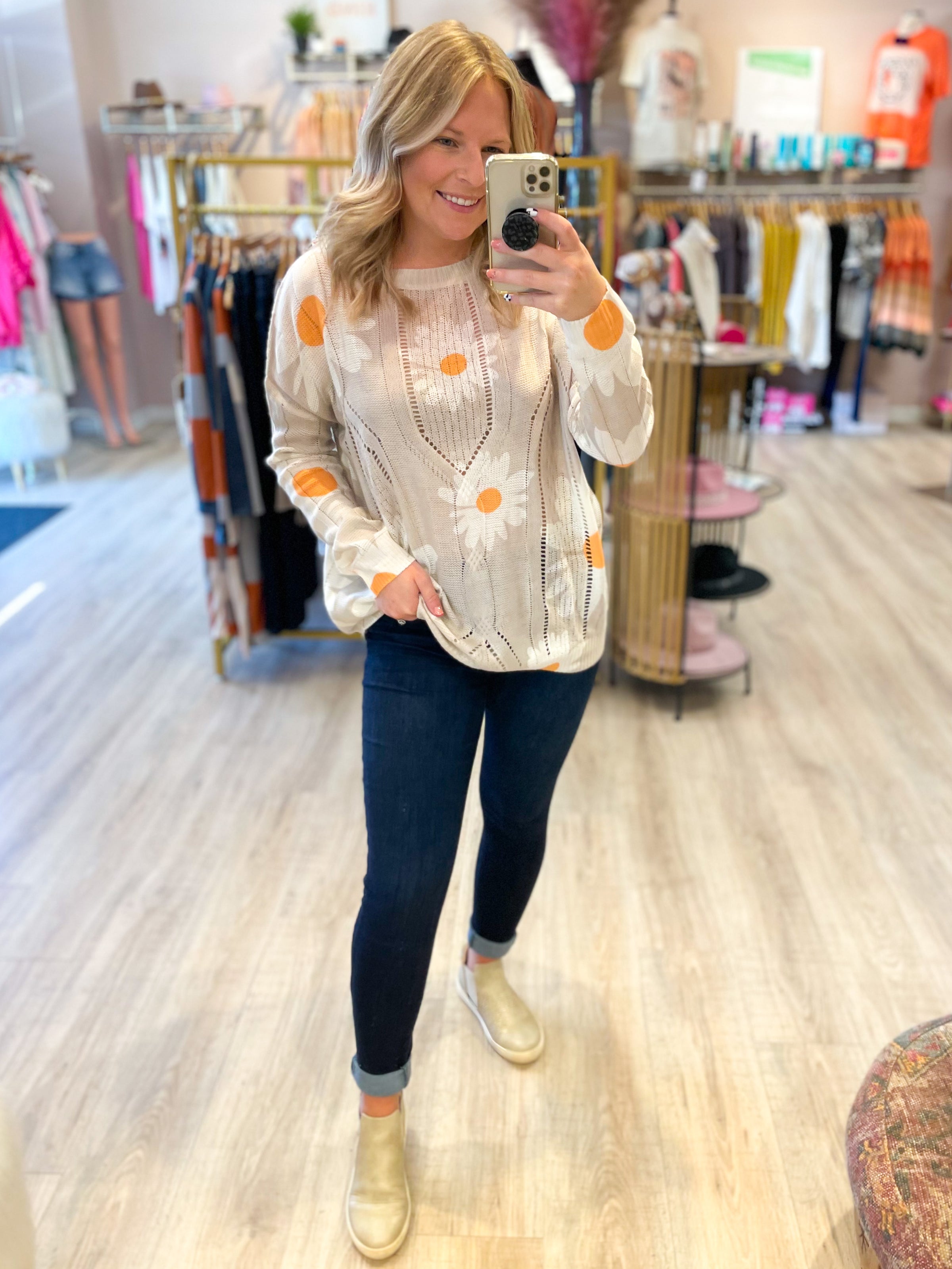 cream open knit sweater with daisies