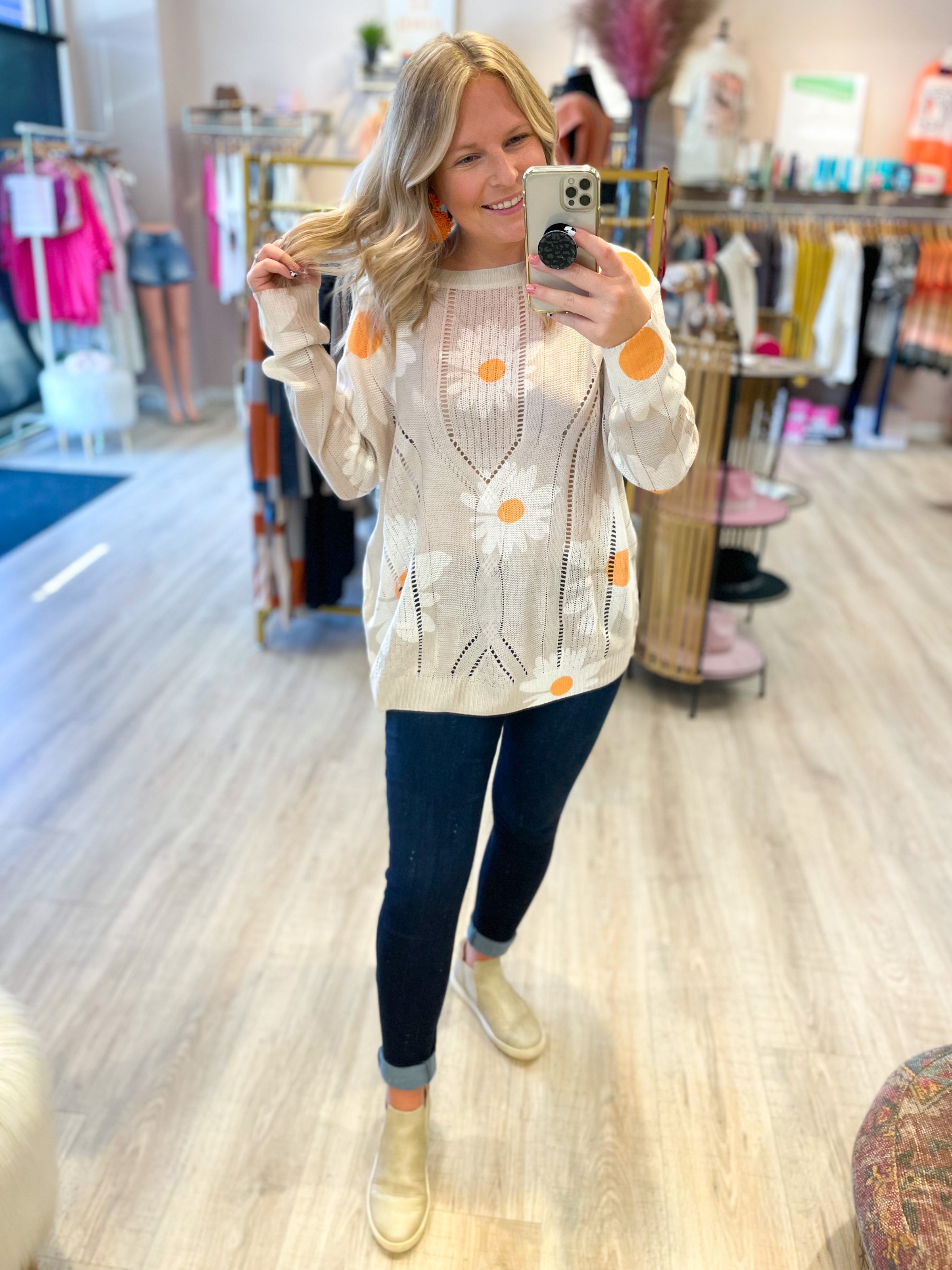 cream open knit sweater with daisies