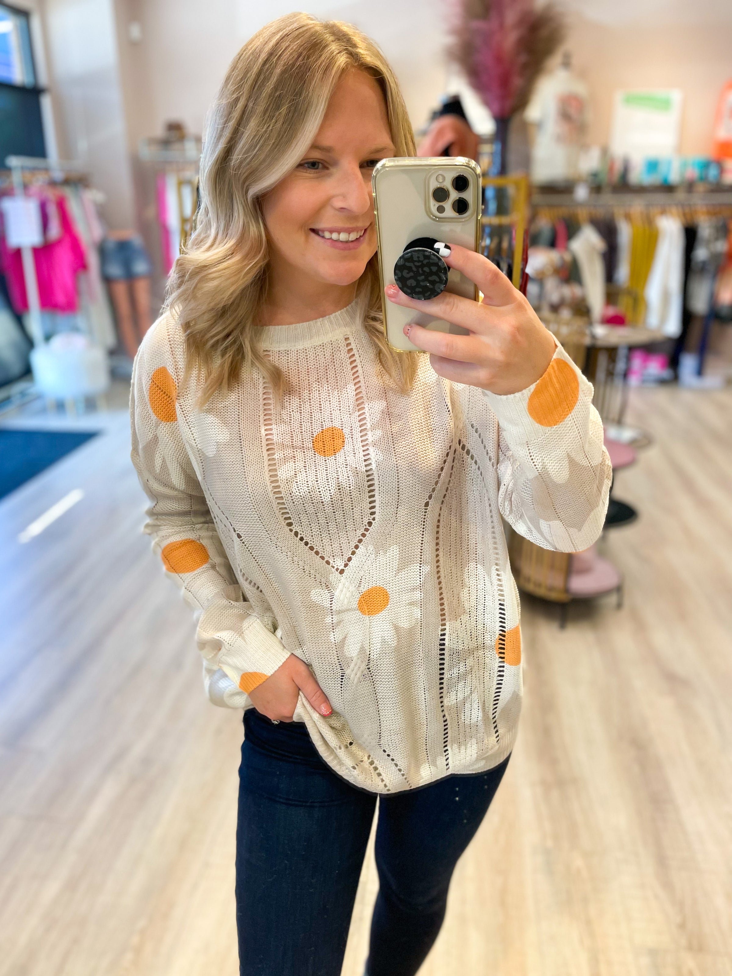 cream open knit sweater with daisies